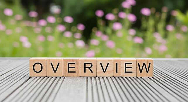 Wooden blocks spelling Overview resting on a gray wooden surface in a garden setting providing a clear summary and concise understanding of a topic offering a comprehensive perspective and a sense of photo