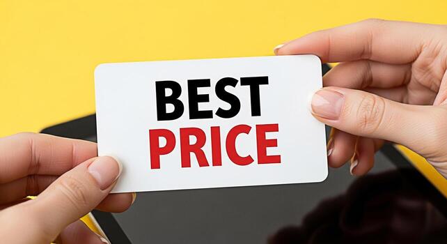 Womans hands holding a card with the words Best Price in front of a tablet on a yellow background promoting affordability and value for money in a bright and cheerful setting photo