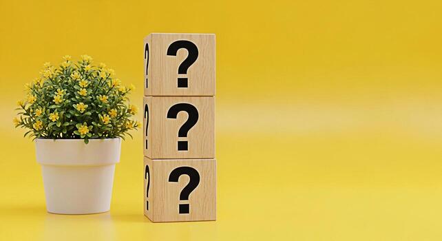 Stack of wooden blocks displaying question marks next to a potted yellow flower on a vibrant yellow background representing uncertainty curiosity and the search for answers in a bright and cheerful se photo