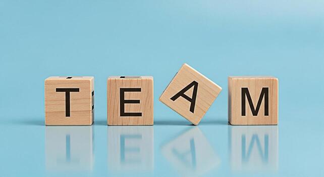 de madera bloques ortografía equipo en un ligero azul superficie simbolizando colaboración y unidad promoviendo un positivo y apoyo trabajo ambiente para lograr común metas y Fomentando trabajo en equipo foto