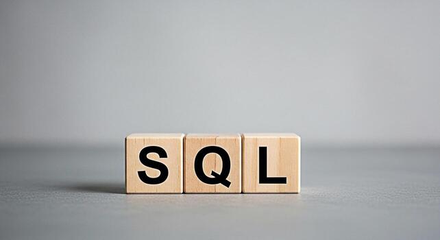 Wooden blocks displaying SQL on a gray surface representing database management and data querying conveying a concept of structured query language and efficient data handling in a minimalist setting photo