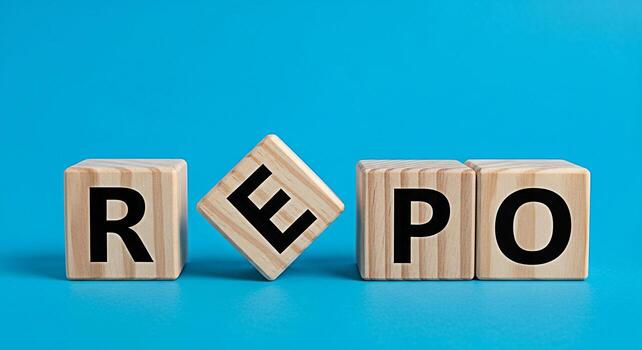Wooden blocks spelling out REPO on a vibrant blue surface representing repurchase agreements and financial transactions in a clear and concise manner symbolizing business and finance concepts photo