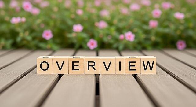 Wooden blocks spelling OVERVIEW on a wooden surface with a blurred background of pink flowers representing a summary or general look at a topic offering a sense of clarity and understanding photo