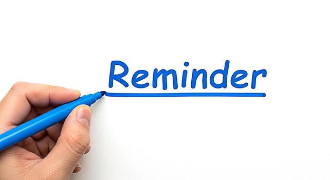 Hand underlining the word Reminder on a white surface with a blue marker emphasizing the importance of tasks and deadlines in a clean and organized workspace promoting productivity and time management photo