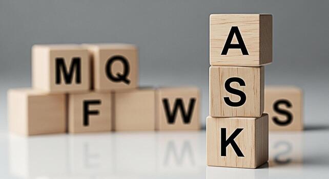 Wooden blocks spelling ASK stacked on a reflective surface inviting questions and curiosity in a minimalist studio setting promoting engagement and knowledgeseeking with other blocks blurred in the ba photo