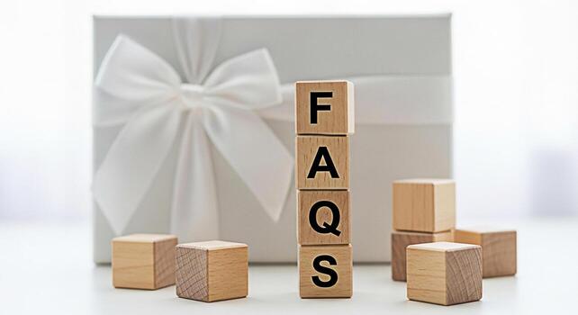 Wooden blocks spelling FAQs in a bright clean studio setting representing frequently asked questions and information resources conveying clarity and support with a modern minimalist aesthetic photo