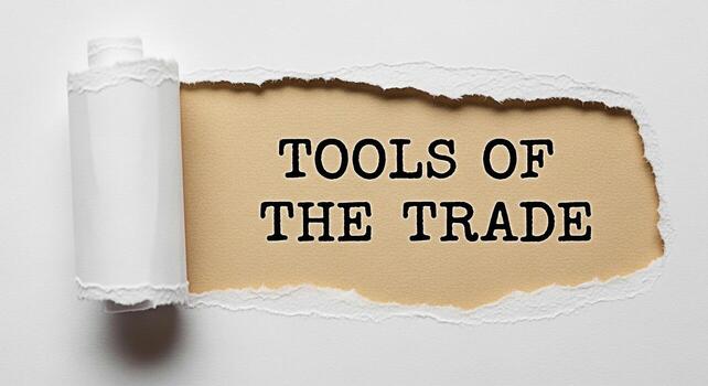 Revealing the Tools of the Trade message on a torn paper background symbolizing expertise and essential resources for success in business craftsmanship or any specialized field conveying a sense of kn photo