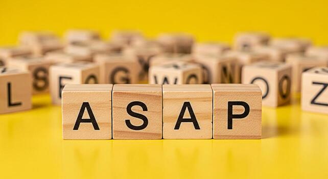 Wooden blocks spelling ASAP on a bright yellow surface conveying a sense of urgency and importance in a fastpaced business environment emphasizing the need for prompt action and efficient task managem photo