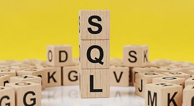 SQL letters stacked on wooden blocks against a yellow background representing database management and data querying symbolizing structured information and efficient data retrieval in a clean and organ photo