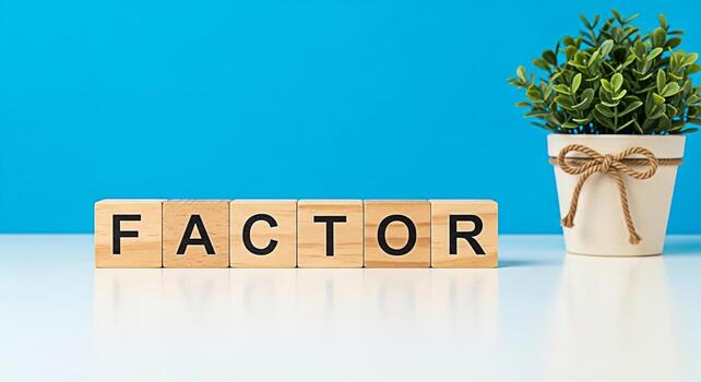 Wooden blocks spelling FACTOR on a white table against a vibrant blue background symbolizing key elements and influential aspects creating a sense of importance and analytical focus in a clean modern photo