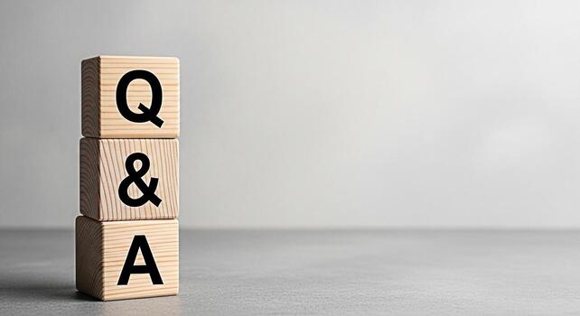 Wooden blocks displaying Q A in a neutral studio setting representing knowledge learning and problemsolving ideal for educational content business presentations and customer service materials conveyin photo
