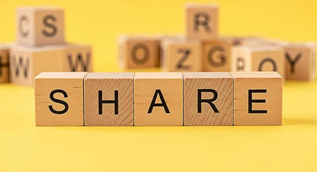 Wooden blocks spelling SHARE on a bright yellow background promoting connection and community through social media and content sharing fostering a collaborative and inclusive online environment photo