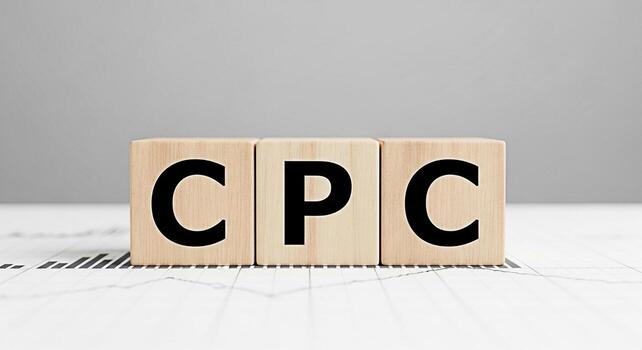Wooden blocks displaying CPC on a financial chart in a bright studio representing cost per click advertising online marketing strategy and pay per click campaign success emphasizing business growth an photo
