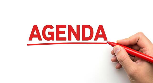 Hand underlining the word Agenda in red marker on a clean white background symbolizing planning organization and the importance of having a clear roadmap for meetings and projects conveying a sense of photo