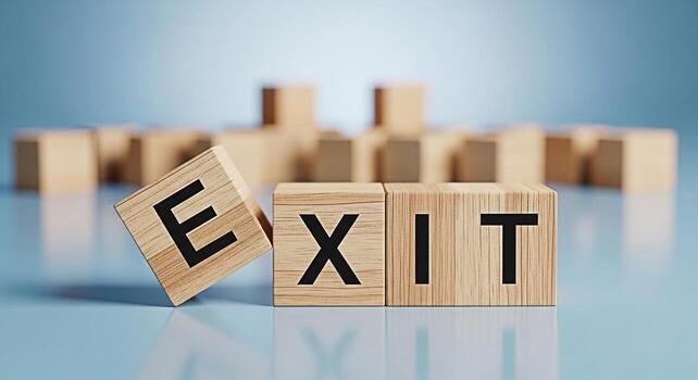 Wooden blocks spelling EXIT on a blue surface suggesting a strategic decision point symbolizing choices escape or a new beginning evoking a sense of urgency and the need for careful consideration photo