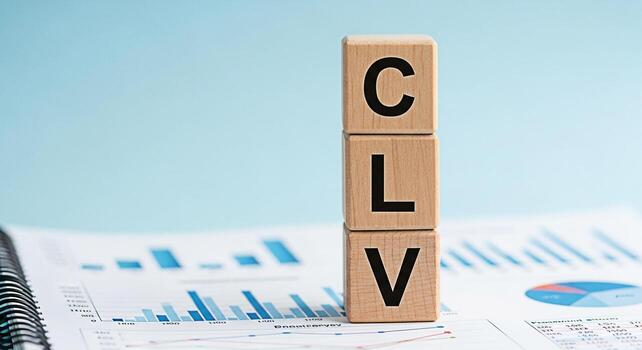 Wooden blocks displaying CLV on a financial report symbolizing Customer Lifetime Value in a business setting representing strategic planning and datadriven decisionmaking for longterm success and prof photo