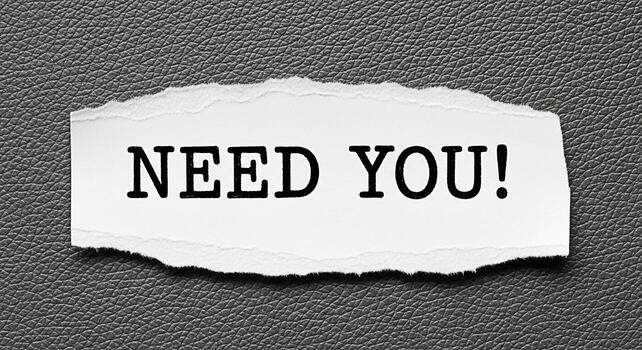 Torn paper displaying the urgent message Need You on a textured gray background conveying a sense of desperation and immediate requirement for assistance or support in a critical situation photo