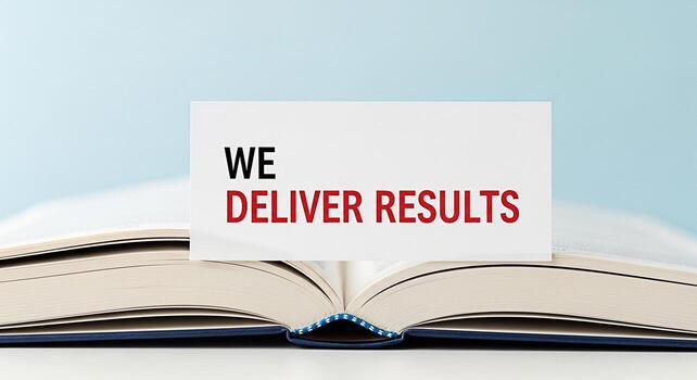 Open book displaying a card with the text We Deliver Results against a light blue backdrop symbolizing commitment and achievement in business education and personal development conveying a message of photo