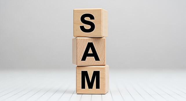 Stacked wooden blocks spelling SAM on a white surface representing a simple and clean design suitable for various creative projects conveying a sense of minimalism and clarity in a studio setting photo