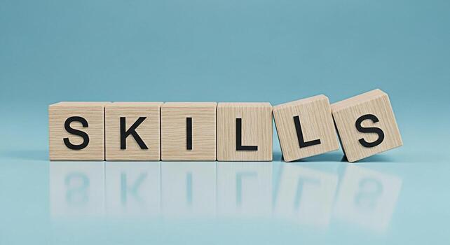Wooden blocks spelling out SKILLS on a light blue surface representing the importance of learning and development in a minimalist and clean setting conveying a message of growth and competence photo