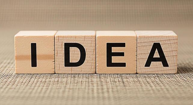 de madera bloques ortografía idea en un texturizado superficie representando creatividad y innovación en un neutral ajuste simbolizando lluvia de ideas y el Generacion de nuevo conceptos foto