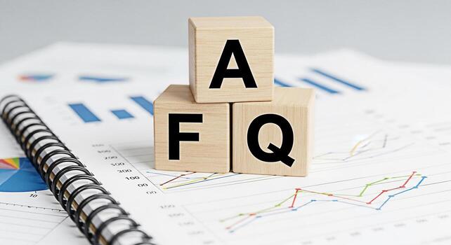 Wooden blocks spelling FAQ on a financial report symbolizing frequently asked questions and information in a business setting conveying clarity and guidance for investment decisions and understanding photo