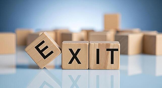 Wooden blocks spelling EXIT on a reflective surface symbolizing a strategic departure or a planned exit strategy in a business context set against a blurred background conveying a sense of decision an photo