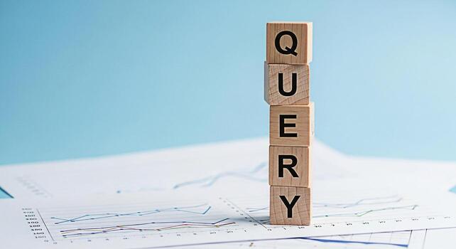 Wooden blocks spelling QUERY stacked on financial charts in a bright studio setting representing data analysis information retrieval and the importance of asking the right questions for business succe photo