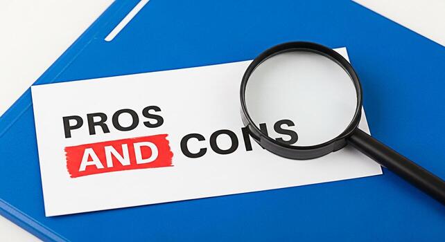 Closeup of a magnifying glass examining a paper with Pros and Cons written on it placed on a blue folder symbolizing careful analysis and decisionmaking in a business or personal context photo