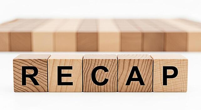 Wooden blocks spelling RECAP on a white surface representing a summary or review conveying a sense of reflection and analysis perfect for business presentations or educational materials photo