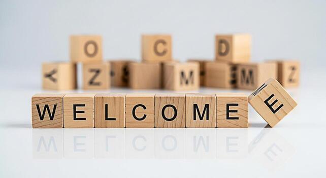 Wooden blocks spelling WELCOME on a white surface creating a warm and inviting atmosphere perfect for greeting new visitors conveying hospitality and symbolizing a friendly and inclusive environment photo