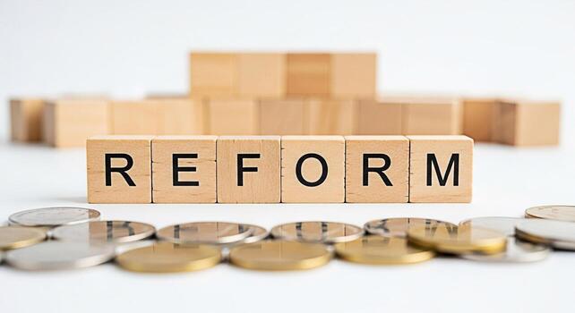 Wooden blocks spelling REFORM amidst scattered coins on a white surface symbolizing financial restructuring and policy changes creating a sense of hope and positive transformation for a better future photo