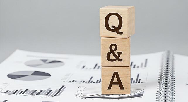 Wooden blocks displaying QA stacked on a financial report symbolizing information gathering and problemsolving in a business setting fostering a sense of clarity and informed decisionmaking photo