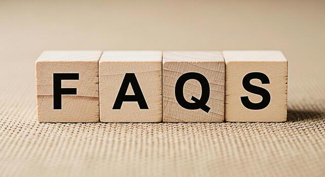 Wooden blocks spelling out FAQs on a textured surface representing frequently asked questions and providing information creating a sense of clarity and guidance for users seeking answers photo