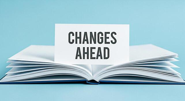 Open notebook displaying a card with the message Changes Ahead on a light blue background symbolizing anticipation and the welcoming of new opportunities in business and personal development photo