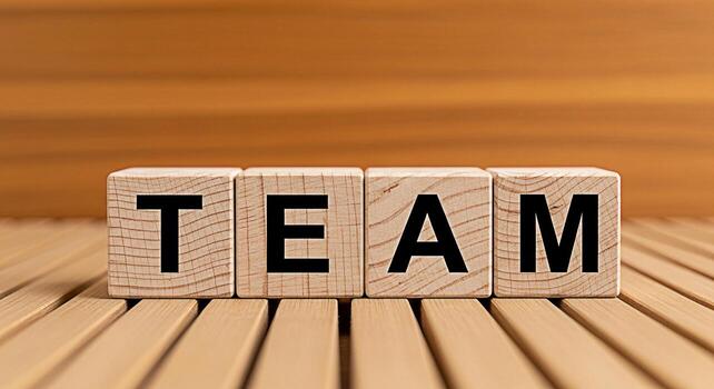 de madera bloques ortografía equipo en un de madera superficie simbolizando colaboración y unidad en un negocio ajuste Fomentando un sentido de trabajo en equipo y compartido éxito promoviendo un positivo y cooperativa atmósfera foto