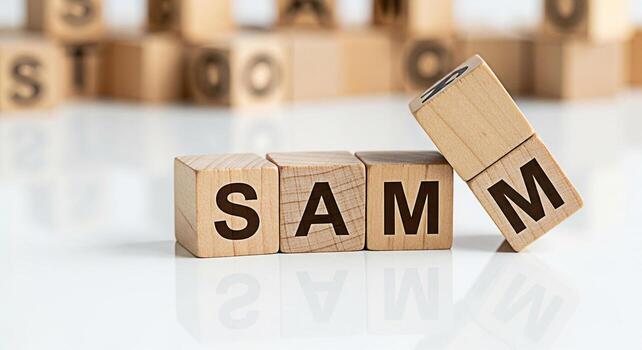 Wooden blocks spelling out SAM on a reflective white surface conveying a sense of simplicity and clarity perfect for illustrating concepts related to names initials or personalized branding in a clean photo