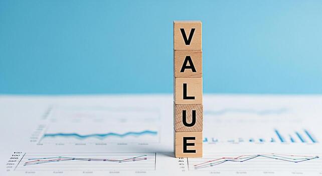 Wooden blocks spelling VALUE standing tall on financial reports against a serene blue backdrop symbolizing growth investment and the importance of valuedriven decisionmaking in business and finance photo