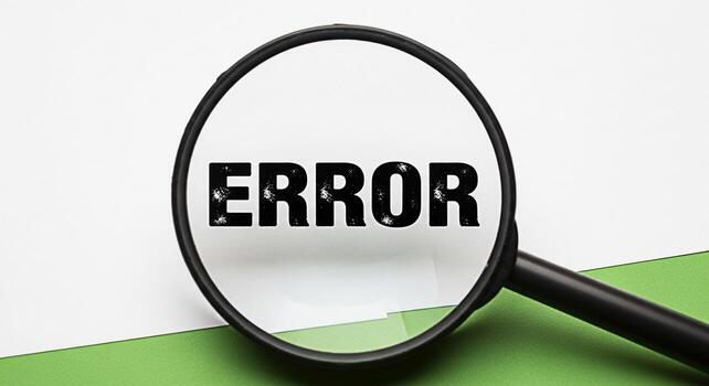 Magnifying glass focusing on the word ERROR on a white paper against a green background symbolizing a problem bug or mistake that needs to be found and fixed representing a critical issue photo