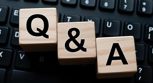 Wooden blocks displaying QA on a black computer keyboard symbolizing questions and answers in a digital environment fostering a sense of knowledge sharing and interactive communication online photo
