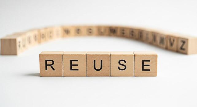Wooden blocks spelling REUSE on a white surface promoting environmental awareness and sustainability symbolizing ecofriendly practices and a commitment to reducing waste in a bright and minimalist set photo