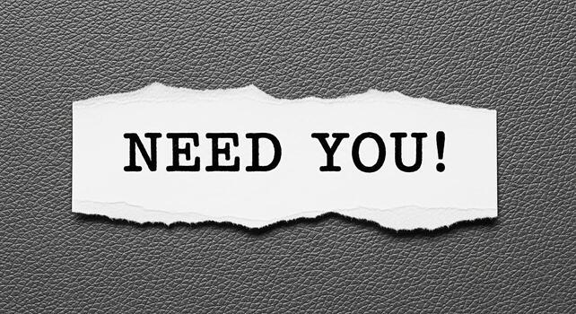 Torn paper message displaying Need You on a textured gray background conveying a sense of urgency and requirement ideal for recruitment assistance or support themes in business and personal contexts photo