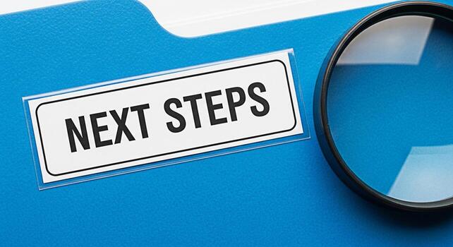 Blue folder displaying Next Steps label magnified by a nearby magnifying glass representing planning and strategic foresight in a business or project management context emphasizing future direction an photo