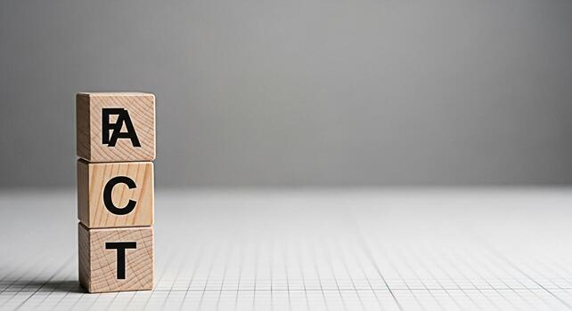 Wooden blocks spelling FACT stacked on a white grid surface against a gray backdrop symbolizing truth reality and the importance of factual information in decisionmaking and knowledge acquisition photo