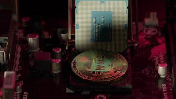 Bitcoin mining. BTC and CPU central processor on the digital technology pc motherboard. Market trading cashless e-commerce. Gold bitcoin cryptocurrency isolated on computer board. New virtual money video