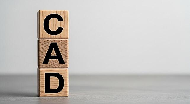 CAD acronym displayed on wooden blocks stacked on a gray surface against a neutral background representing computeraided design drafting and the concept of precision engineering with a clean and moder photo