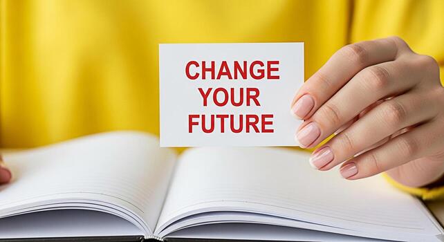 Woman holding a card with the message Change Your Future over an open notebook symbolizing personal growth and selfimprovement in a bright optimistic setting inspiring motivation and positive transfor photo