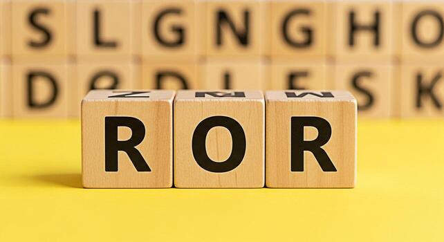 Wooden blocks spelling out ROR on a bright yellow surface symbolizing return on risk and investment strategy in a business setting creating a positive and optimistic financial outlook photo