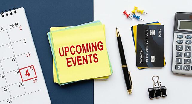 Closeup of a calendar and sticky notes displaying Upcoming Events on a modern office desk alongside a pen credit cards calculator and push pins creating a sense of organization and planning for future photo