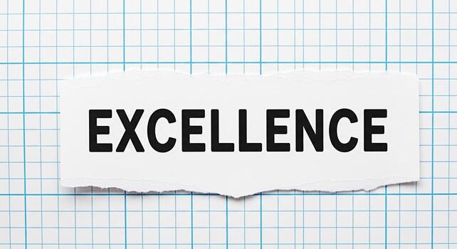 The word Excellence displayed on a torn piece of paper against a blue grid background symbolizing a commitment to high standards and quality in a structured environment fostering a sense of precision photo